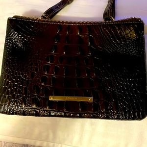 Brahmin cross body with two zippered compartments. Very dark brown on color
